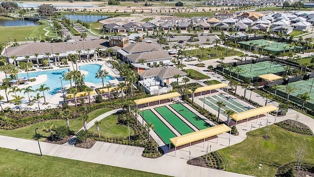 bird's eye view featuring a water view and a residential view