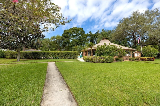 view of property's community with a yard