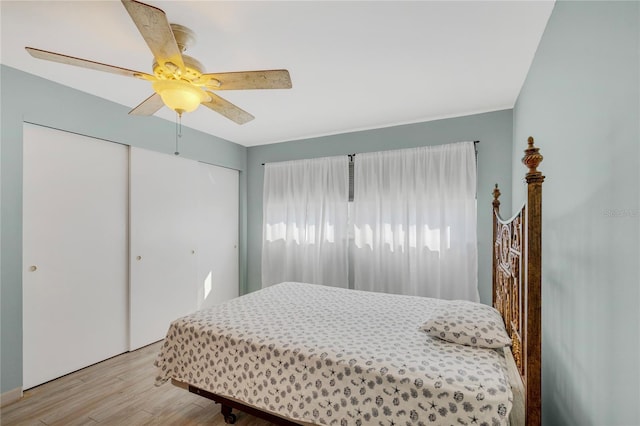 bedroom featuring a ceiling fan and wood finished floors