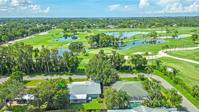 aerial view featuring golf course view and a water view