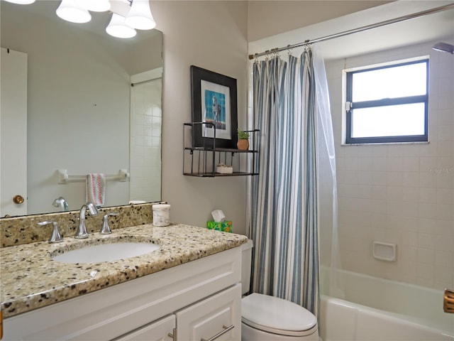 bathroom with vanity, shower / tub combo, and toilet