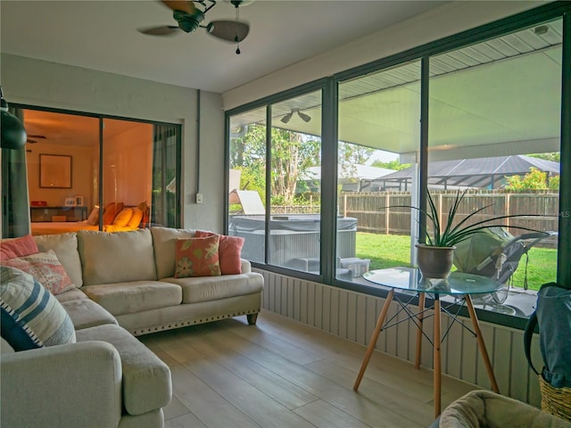 sunroom with ceiling fan