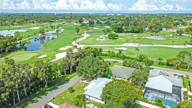 drone / aerial view featuring a water view and golf course view