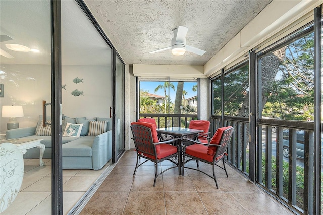 sunroom featuring plenty of natural light and a ceiling fan