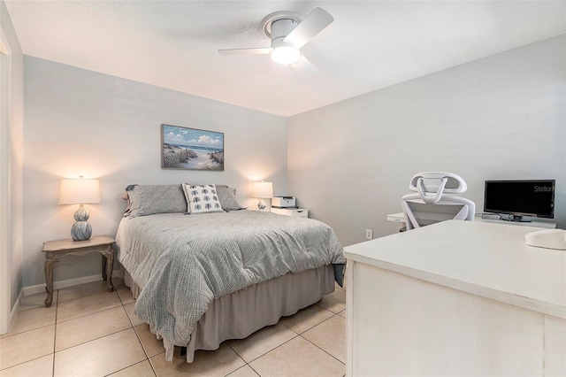 bedroom featuring light tile patterned floors, a ceiling fan, and baseboards