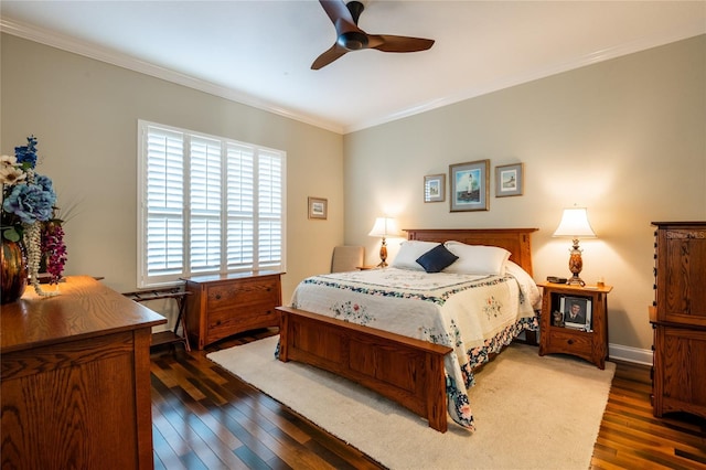 bedroom with hardwood / wood-style floors, a ceiling fan, baseboards, and ornamental molding