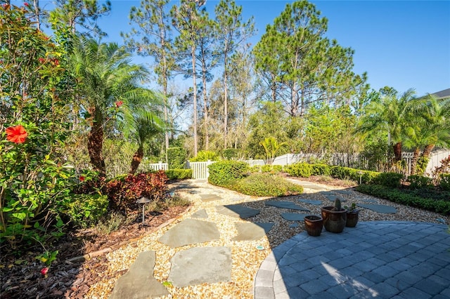 view of home's community featuring a patio area and fence