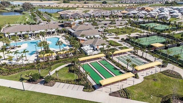 drone / aerial view with a residential view and a water view