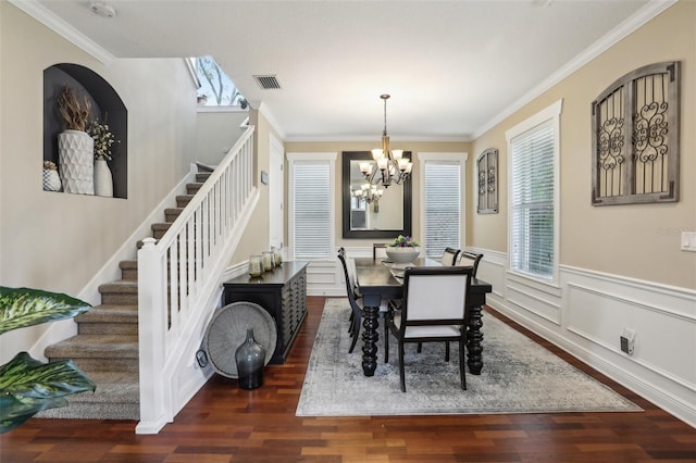 dining area with stairs, a wainscoted wall, dark wood finished floors, and visible vents