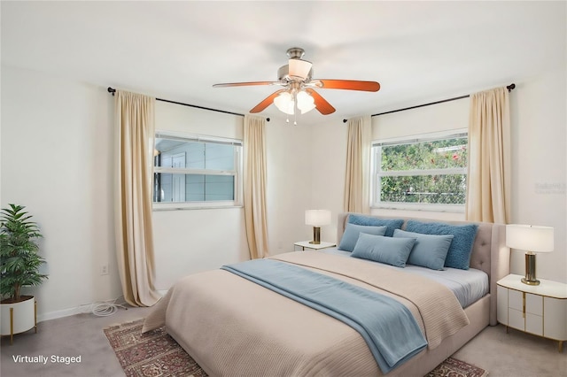 bedroom featuring baseboards and ceiling fan