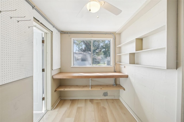 interior space featuring ceiling fan