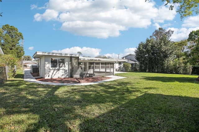 view of yard with fence and a sunroom