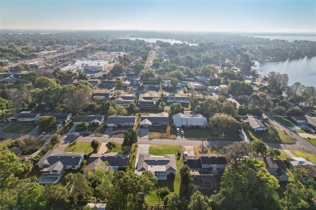 drone / aerial view with a residential view and a water view