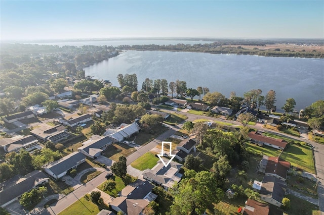 drone / aerial view with a water view and a residential view