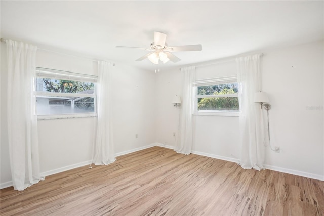 1841 5th St SE, Winter Haven, FL 33880 - spare room with ceiling fan, baseboards, and light wood-style flooring