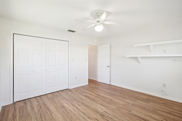 1841 5th St SE, Winter Haven, FL 33880 - unfurnished bedroom featuring light wood-type flooring, visible vents, a closet, baseboards, and ceiling fan