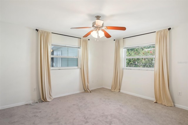 1841 5th St SE, Winter Haven, FL 33880 - spare room with light colored carpet, baseboards, and a ceiling fan