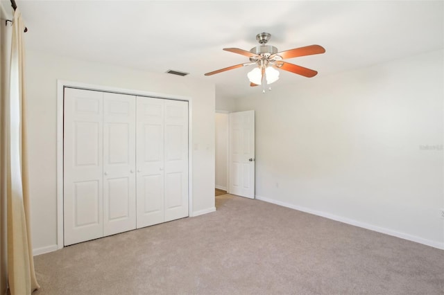 1841 5th St SE, Winter Haven, FL 33880 - unfurnished bedroom featuring light colored carpet, visible vents, a closet, and baseboards