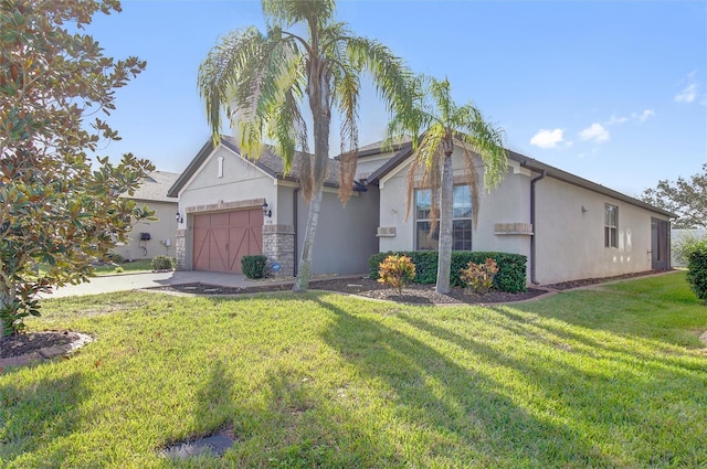 view of front of house featuring stucco siding, driveway, a front lawn, and a garage