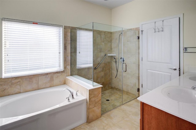 full bath featuring a sink, double vanity, a bath, and a shower stall