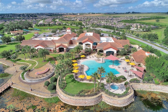 birds eye view of property with a residential view