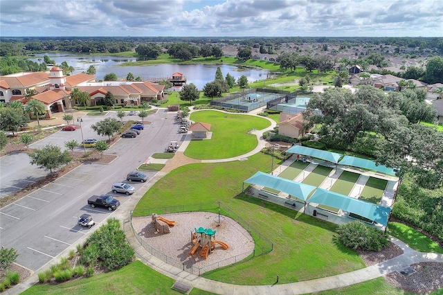 drone / aerial view with a residential view and a water view