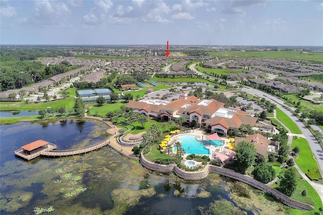 drone / aerial view featuring a residential view and a water view