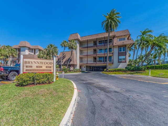 3021 Countryside Blvd Unit 23A, Clearwater, FL 33761 - view of building exterior featuring uncovered parking