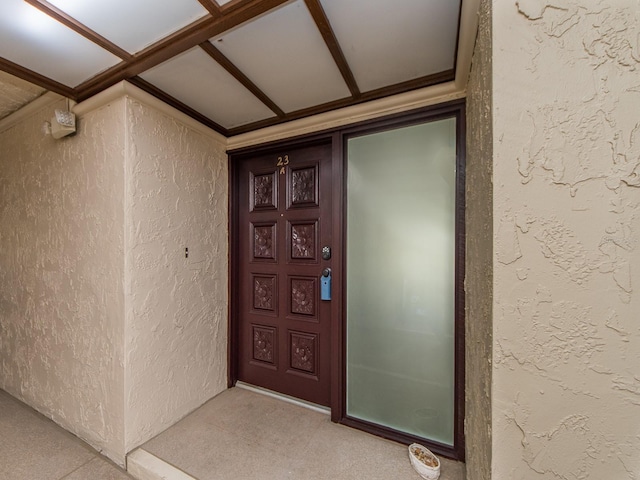 property entrance featuring stucco siding