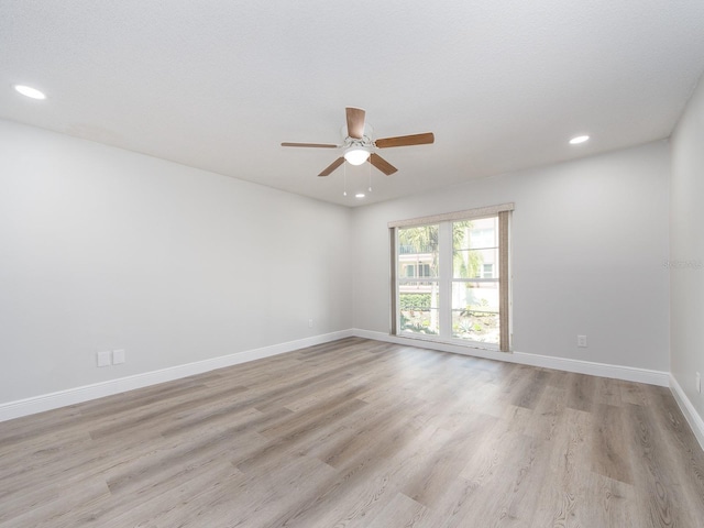 unfurnished room featuring recessed lighting, baseboards, light wood finished floors, and ceiling fan