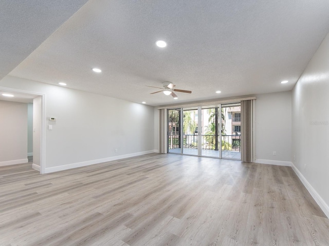 3021 Countryside Blvd Unit 23A, Clearwater, FL 33761 - spare room with baseboards, recessed lighting, light wood-style flooring, a textured ceiling, and a ceiling fan