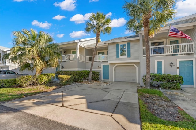 view of property featuring driveway and an attached garage