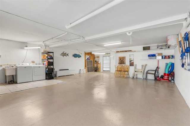 garage featuring washing machine and clothes dryer