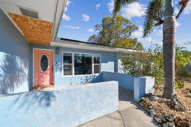 2451 Baywood Dr W, Dunedin, FL 34698 - view of front facade with stucco siding