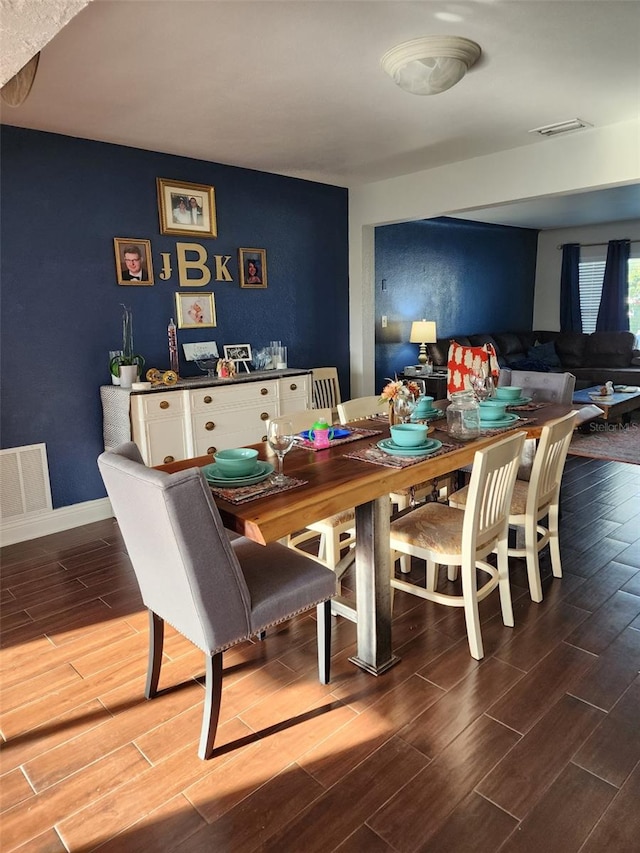 2451 Baywood Dr W, Dunedin, FL 34698 - dining room with wood finish floors, visible vents, and baseboards