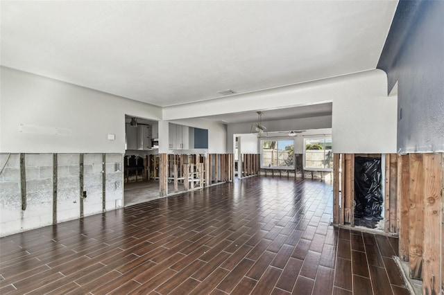 2451 Baywood Dr W, Dunedin, FL 34698 - unfurnished living room with visible vents and wood tiled floor