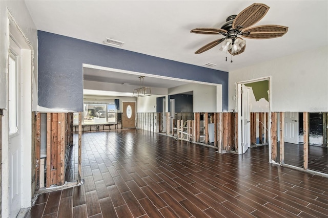 2451 Baywood Dr W, Dunedin, FL 34698 - unfurnished living room featuring wood finish floors, visible vents, and a ceiling fan