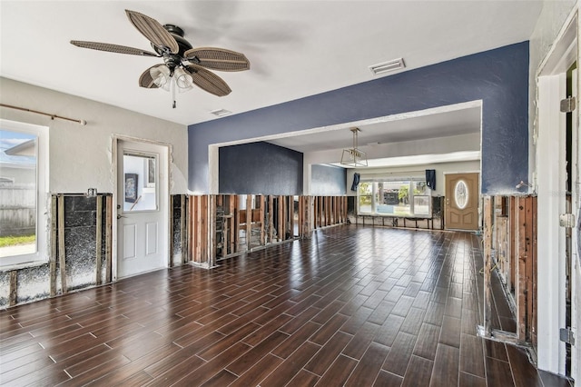 2451 Baywood Dr W, Dunedin, FL 34698 - unfurnished living room featuring a ceiling fan, visible vents, a textured wall, and wood tiled floor