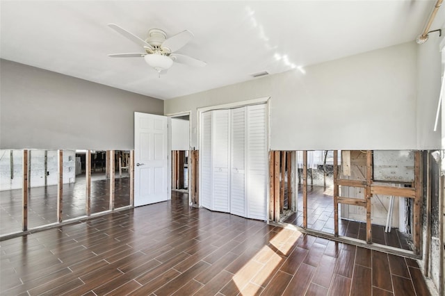 2451 Baywood Dr W, Dunedin, FL 34698 - unfurnished bedroom with a ceiling fan, visible vents, a closet, and wood tiled floor
