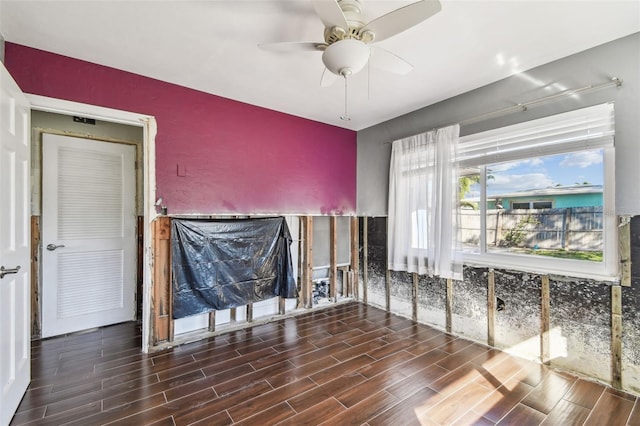 2451 Baywood Dr W, Dunedin, FL 34698 - unfurnished living room featuring a ceiling fan and wood finish floors