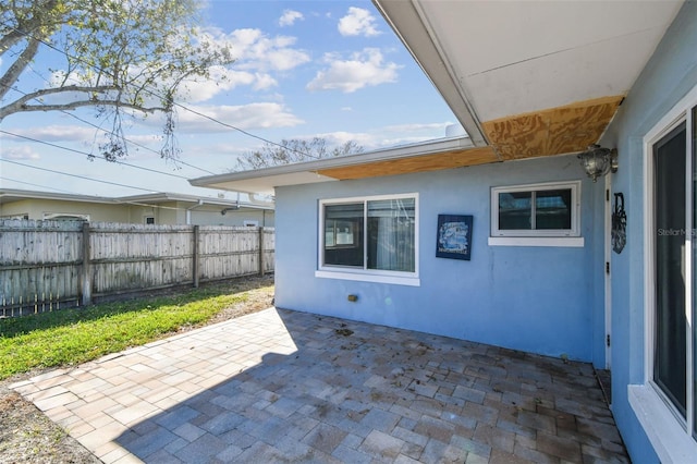 2451 Baywood Dr W, Dunedin, FL 34698 - view of patio with fence