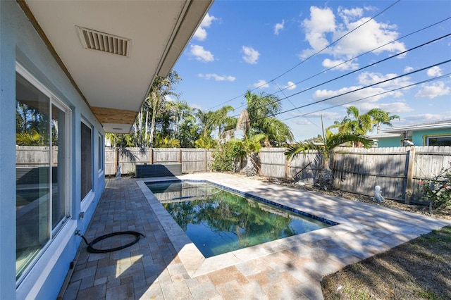 2451 Baywood Dr W, Dunedin, FL 34698 - view of swimming pool featuring a patio area, a fenced in pool, and a fenced backyard