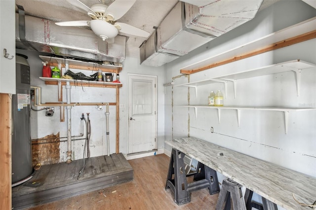 2451 Baywood Dr W, Dunedin, FL 34698 - interior space featuring ceiling fan, wood finished floors, and water heater