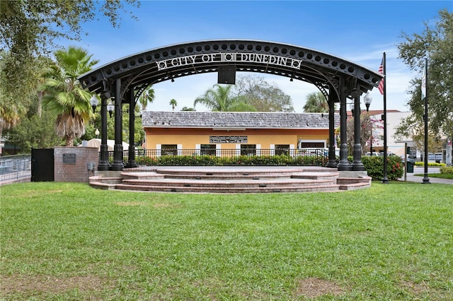 2451 Baywood Dr W, Dunedin, FL 34698 - surrounding community featuring a lawn and fence