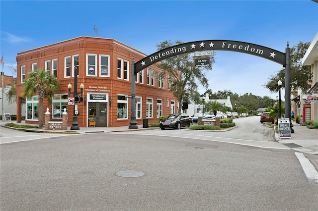 2451 Baywood Dr W, Dunedin, FL 34698 - view of road with sidewalks, curbs, and street lighting