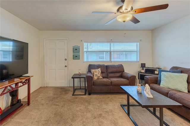 living room with light colored carpet and ceiling fan