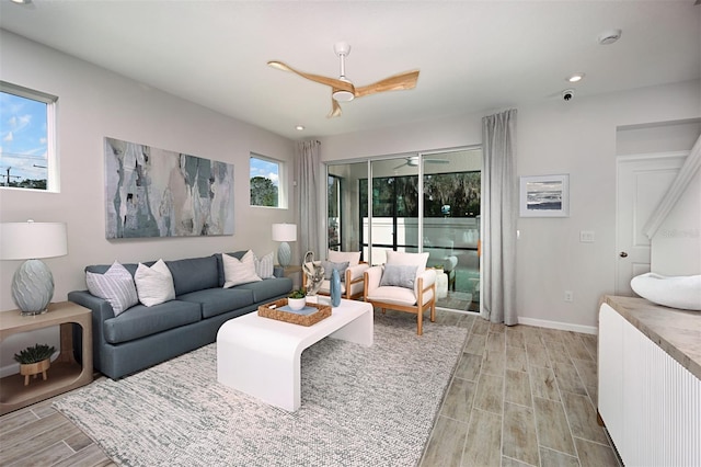 living area with recessed lighting, baseboards, a ceiling fan, and wood tiled floor