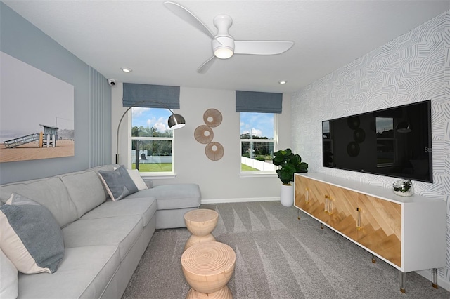 carpeted living room with recessed lighting, ceiling fan, wallpapered walls, and baseboards