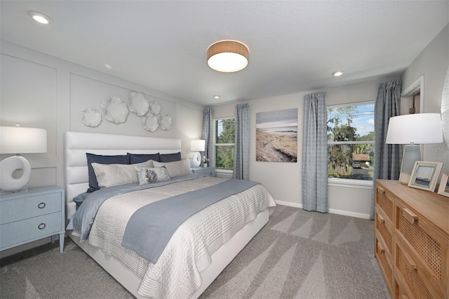 carpeted bedroom with recessed lighting and baseboards