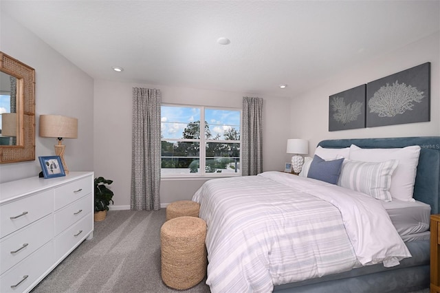 carpeted bedroom featuring recessed lighting and baseboards